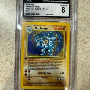 Pokémon Machamp 1st Edition Base Set CGC 8 Graded Holo 1999